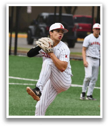 A baseball player in a white and black uniform is throwing a ball. Description generated by AI