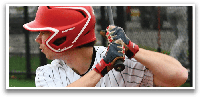 A baseball player in a red helmet and white uniform is holding a bat and getting ready to swing. Description generated by AI