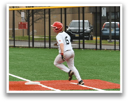 A baseball player running to first base. Description generated by AI