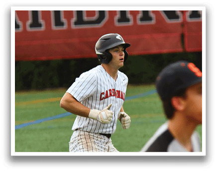 A baseball player wearing a black helmet and a white and black uniform. Description generated by AI
