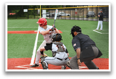 A baseball player is swinging a bat at a ball. Description generated by AI