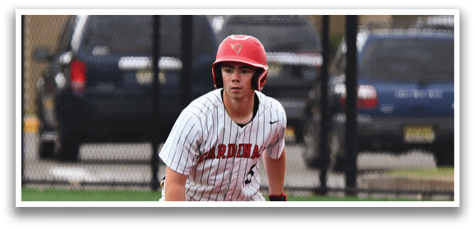 A baseball player wearing a red helmet and white uniform. Description generated by AI