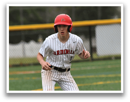 A baseball player wearing a red helmet and white uniform. Description generated by AI