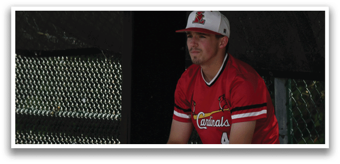 A baseball player wearing a red and white uniform. Description generated by AI