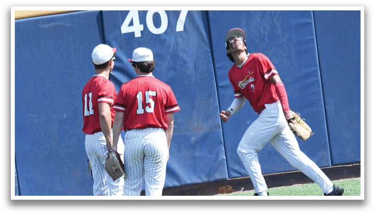 Two baseball players standing on the field. Description generated by AI