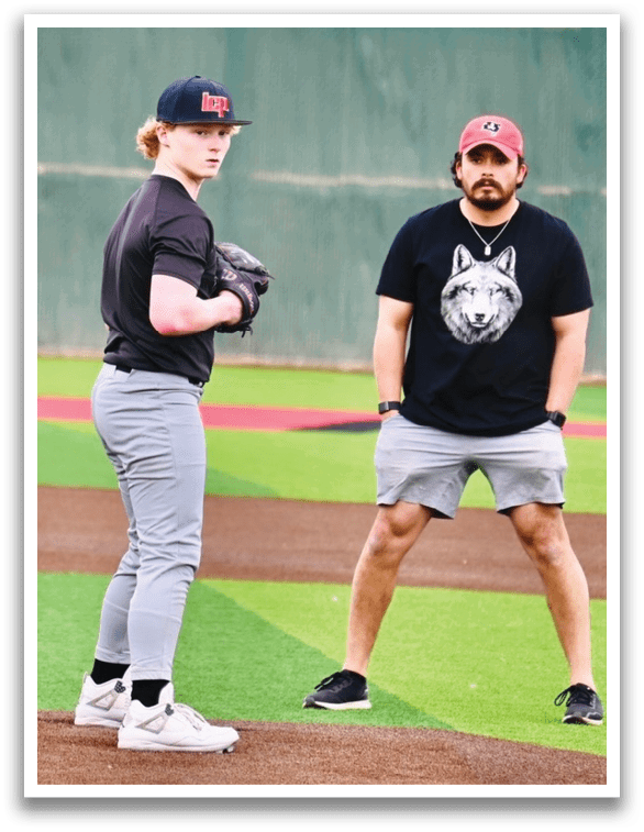 Two men standing on a baseball field, one wearing a black shirt and the other wearing a red shirt. AI generated content