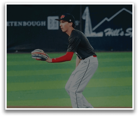 A baseball player in a black shirt and red socks is holding a baseball glove on a field. AI generated content