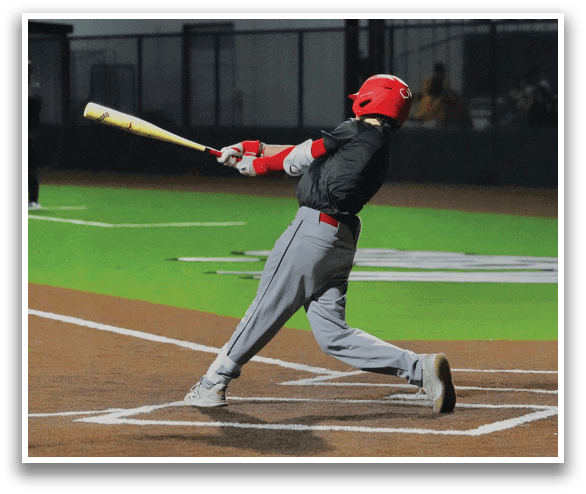 A baseball player in a grey uniform is swinging a bat at a ball. AI generated content