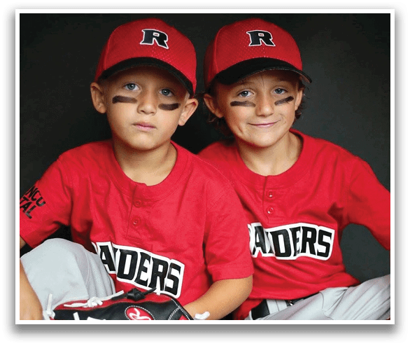 Two young boys wearing red jerseys and black and white hats. AI generated content