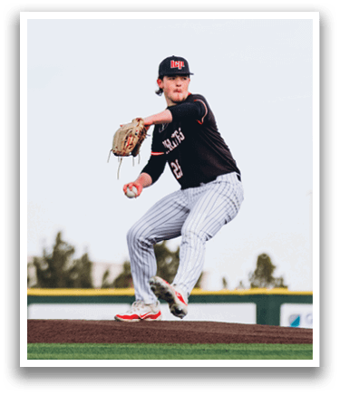 A baseball player in a black and red uniform is pitching a ball on a field. AI generated content