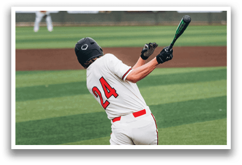 A baseball player in a white uniform is swinging a bat on a field. AI generated content