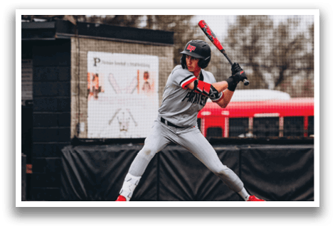A baseball player in a grey uniform is swinging a bat at a ball. AI generated content