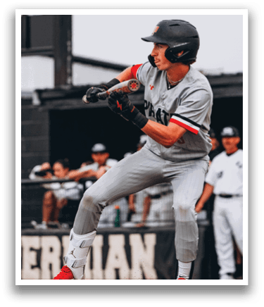 A baseball player in a grey uniform is swinging a bat, attempting to hit a ball. AI generated content
