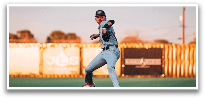 A baseball player in a grey uniform is pitching a ball on a field. AI generated content