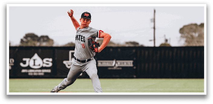 A baseball player in a grey uniform is pitching a ball on a field. AI generated content