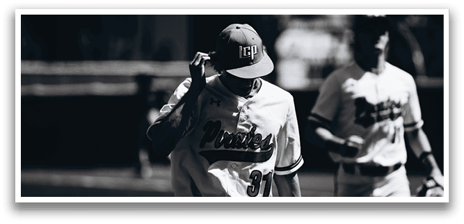 Two baseball players are walking on the field. One player is wearing a hat and shirt with the letters “MU" on it. AI generated content