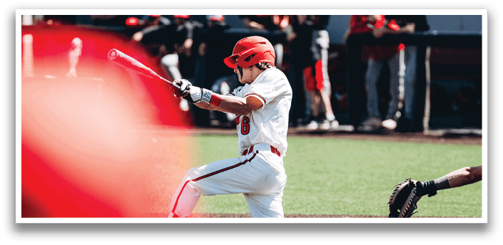 A baseball player in a white uniform is swinging a bat, attempting to hit a ball. AI generated content