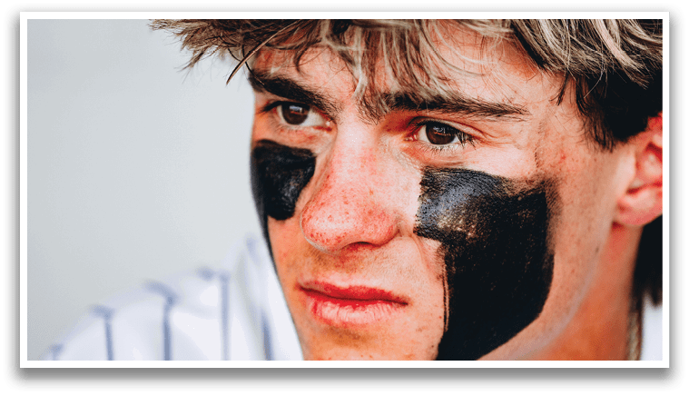 A man with a baseball uniform and a black and white face paint is looking at the camera. AI generated content
