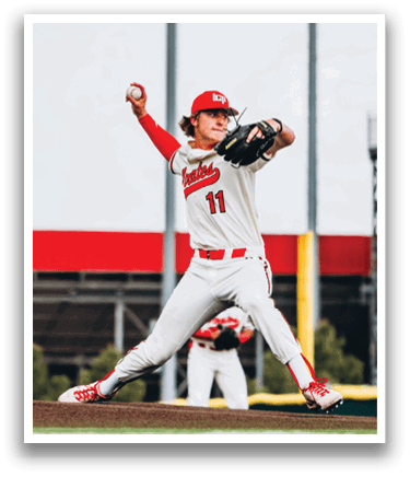 A baseball player in a red and white uniform is pitching a ball. AI generated content