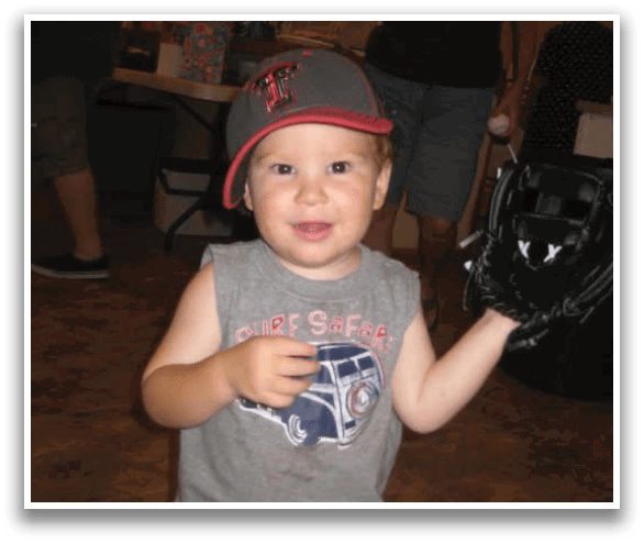 A young boy wearing a baseball cap and holding a baseball glove. AI generated content