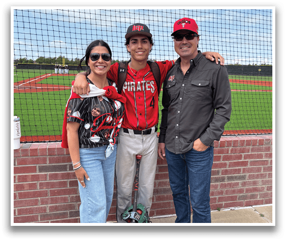 A man, woman, and child pose for a picture on a baseball field. AI generated content