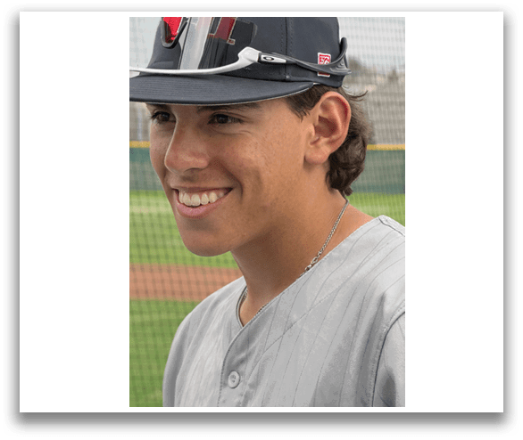 A man wearing a baseball cap and a grey shirt is smiling. AI generated content