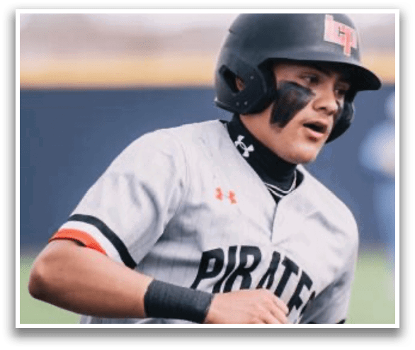A baseball player wearing a grey and black uniform. Description generated by AI