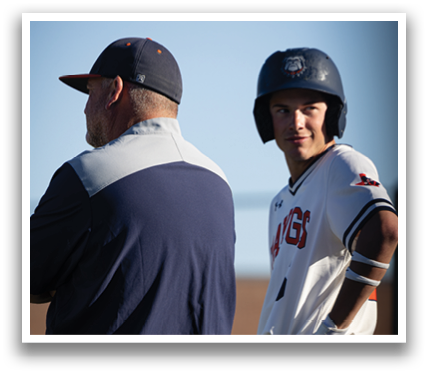 Two men are standing on a baseball field, one of them wearing a baseball helmet. Contenido generado con IA