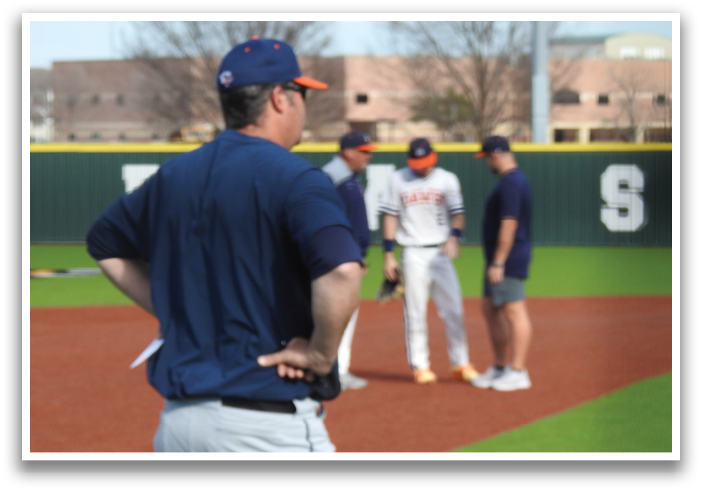 A baseball coach watches his team from the sidelines. Contenido generado con IA