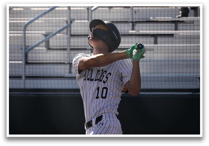 A baseball player is swinging a bat on a field. Contenido generado con IA