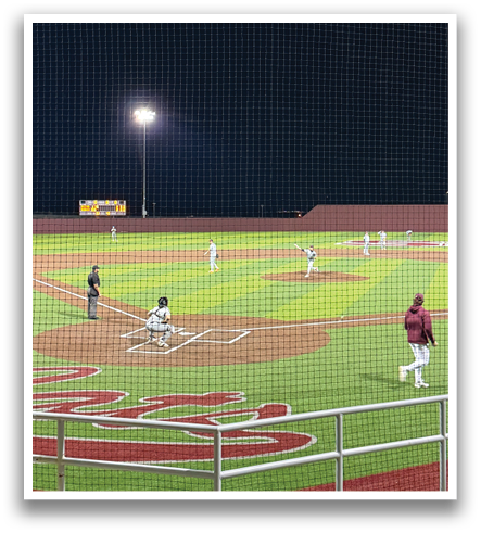Three men are standing on a baseball field, talking to each other. Contenido generado con IA