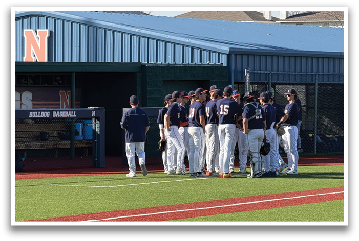 A group of baseball players are standing on a field, some of them wearing helmets. Contenido generado con IA