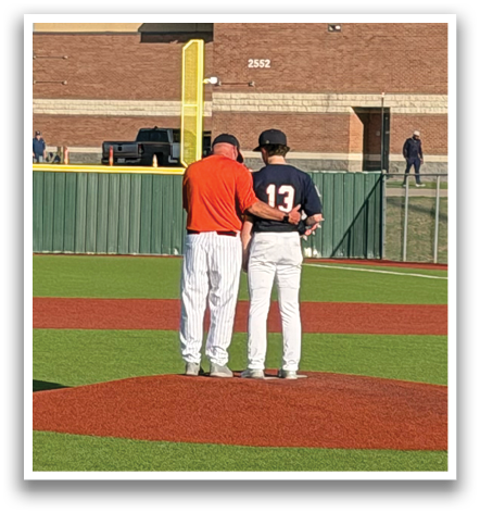 Two baseball players are standing on the field, talking to each other. Contenido generado con IA