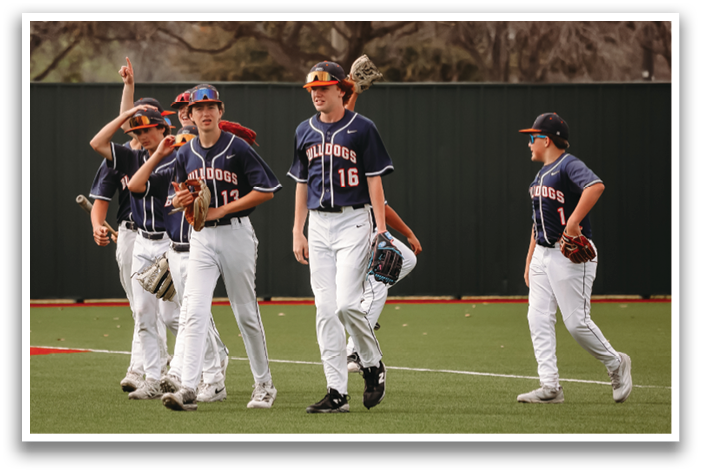 A group of young men wearing baseball uniforms are walking on a field. Contenido generado con IA