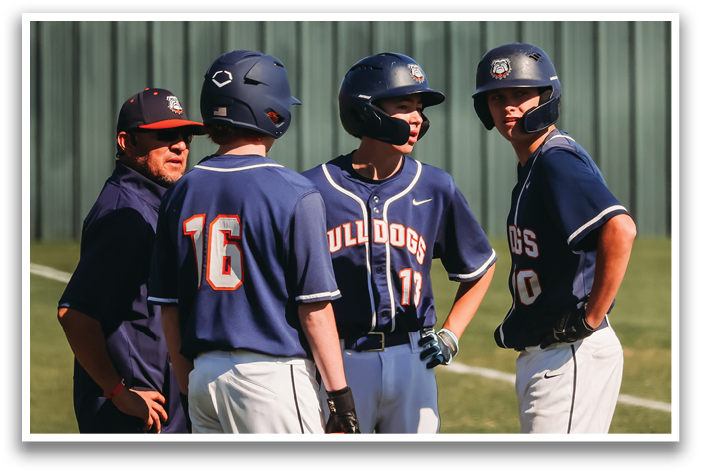 Three baseball players wearing blue uniforms and helmets are standing on a field. Contenido generado con IA