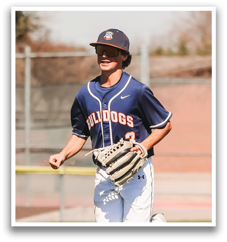 A baseball player in a blue and white uniform is running on the field. Contenido generado con IA