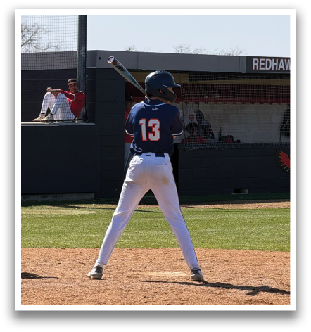 A baseball player is standing on the field, holding a bat. Contenido generado con IA