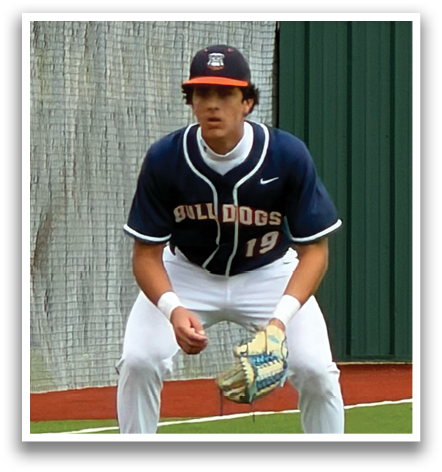 A baseball player in a blue and white uniform is standing on the field, holding a baseball glove. Contenido generado con IA