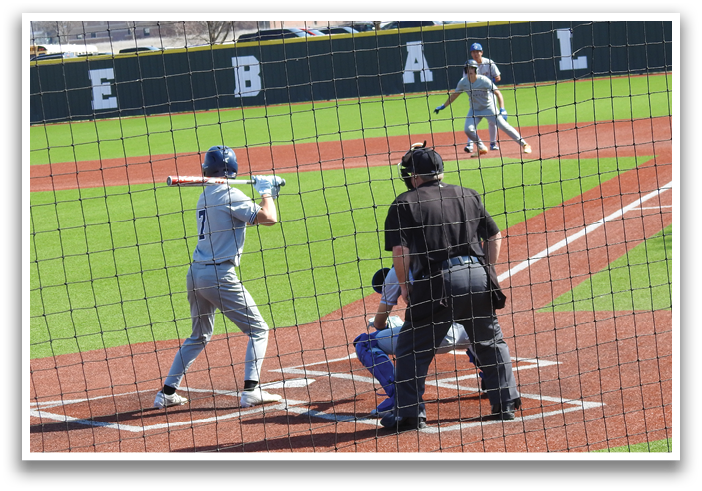 A baseball player is swinging a bat at a ball during a game. Contenido generado con IA