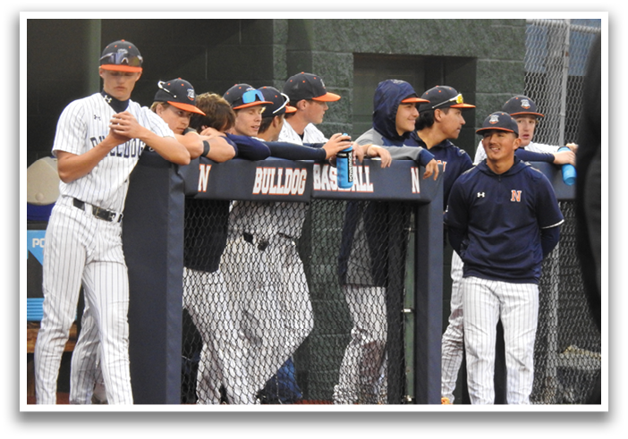 Baseball players in uniforms sitting on the ground. Contenido generado con IA