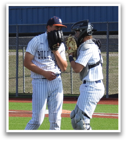 Two baseball players standing on the field, one wearing a number 2 jersey. Contenido generado con IA