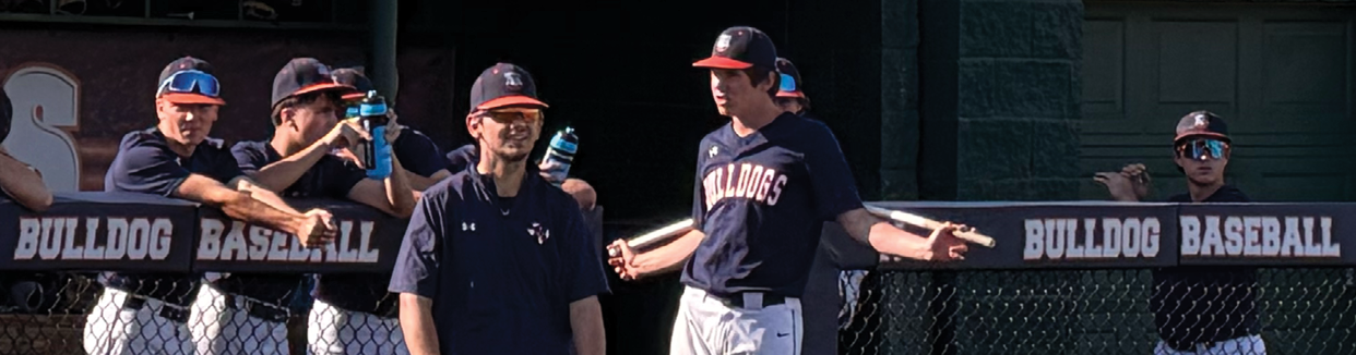 A group of baseball players are standing on a baseball field. Contenido generado con IA