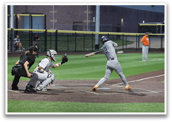 A baseball player is swinging a bat during a game. Contenido generado con IA
