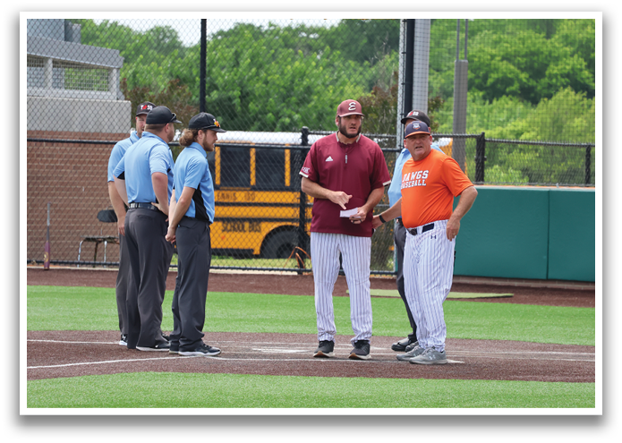A group of men are standing on a baseball field, with one man holding a baseball bat. Contenido generado con IA
