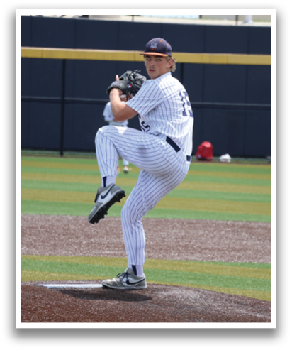 A baseball player in a white and blue uniform is in the process of throwing a pitch. Contenido generado con IA