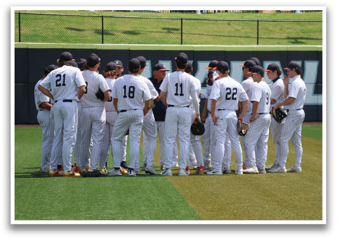 A group of baseball players wearing white uniforms and blue caps are standing on a field. Contenido generado con IA