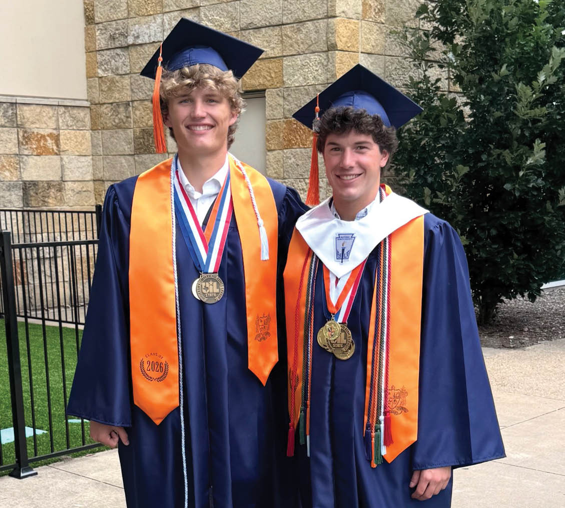 Two young men in blue graduation robes pose for a picture. Contenido generado con IA
