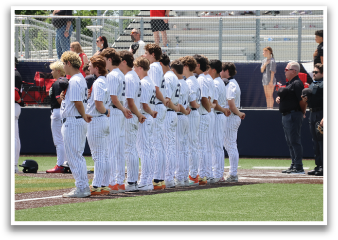A group of baseball players are standing on the field, wearing white uniforms. They are lined up in a row, facing the camera. Contenido generado con IA