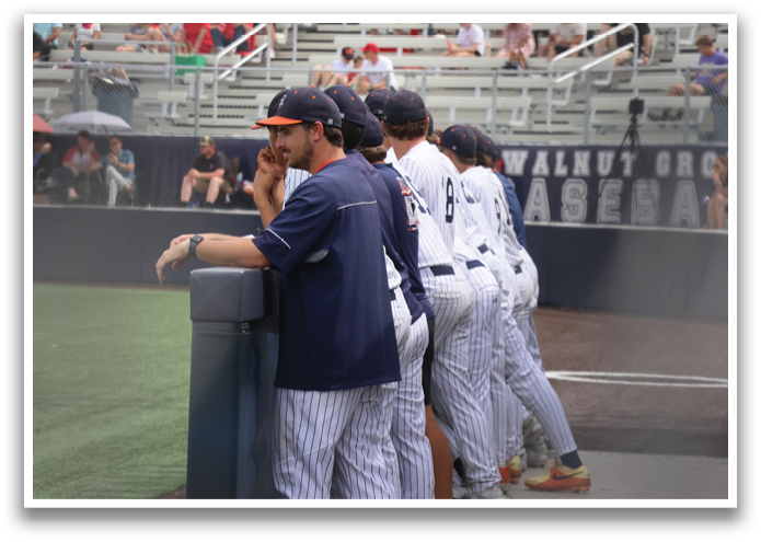 Baseball players in blue and white uniforms are standing on a field. Contenido generado con IA