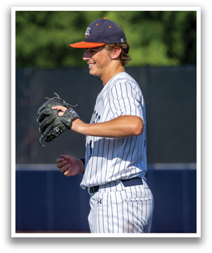 A baseball player wearing a striped shirt and hat is standing on the field. He is holding a baseball glove in his hand. Contenido generado con IA